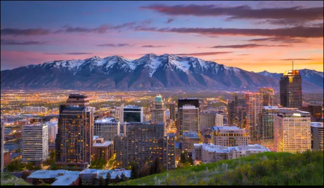 Salt Lake City, Utah skyline at sunset with the Wasatch Mountains in the background